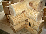 round milled logs in corner