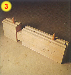 showing drilled log with pegs inserted