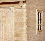 corner detail of milled log shed